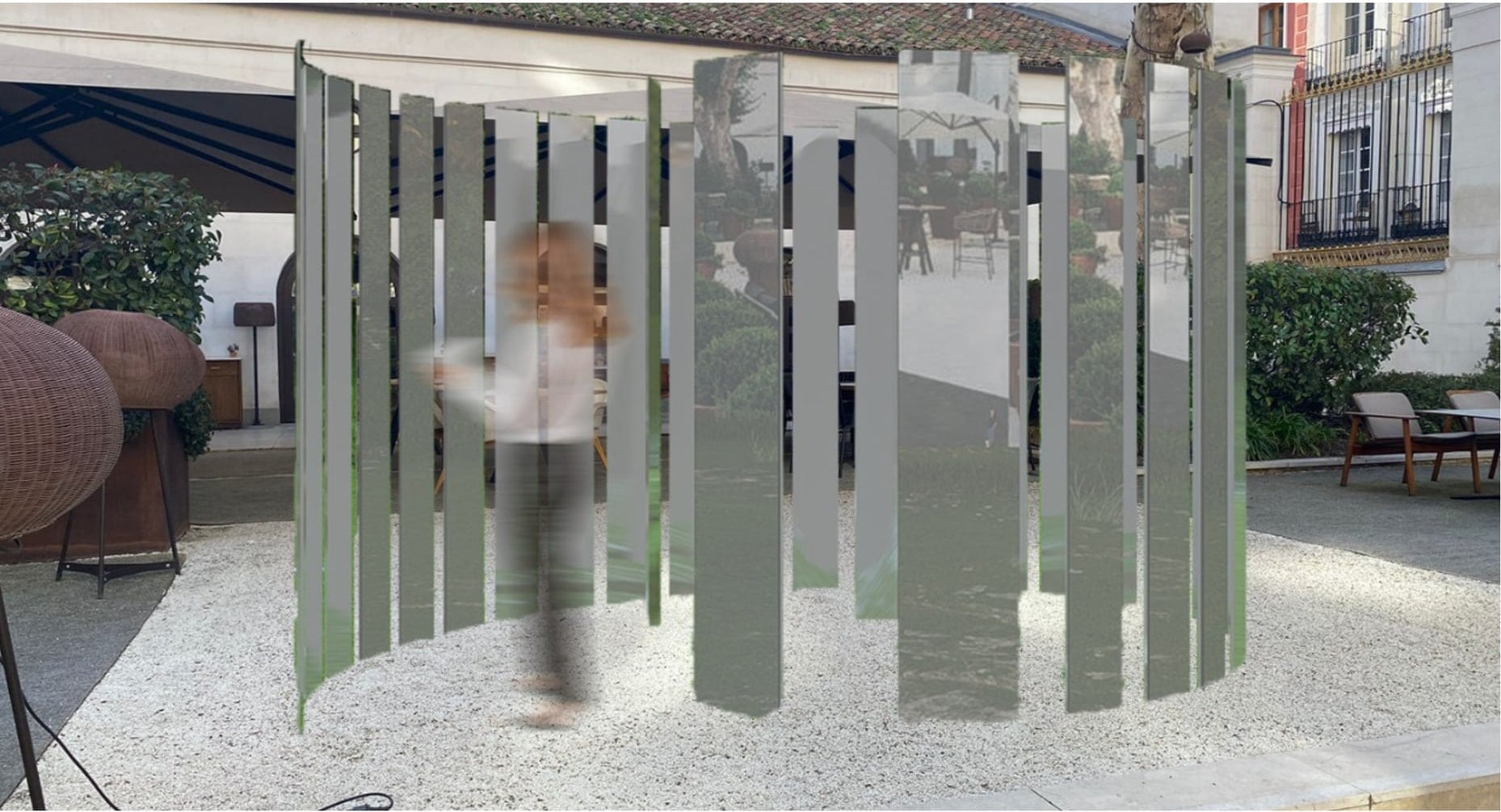 Installation prototype in a courtyard with a visitor walking through